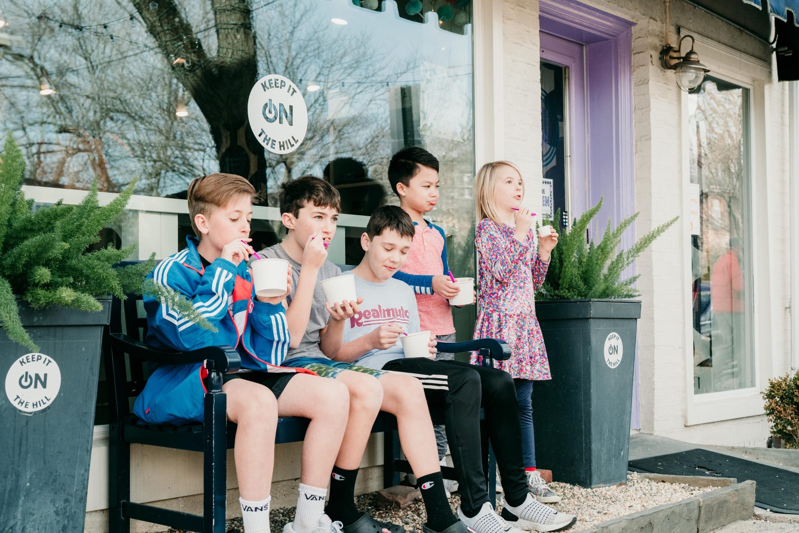 Children enjoying frozen yogurt outside Chill on the Hill in Chestnut Hill