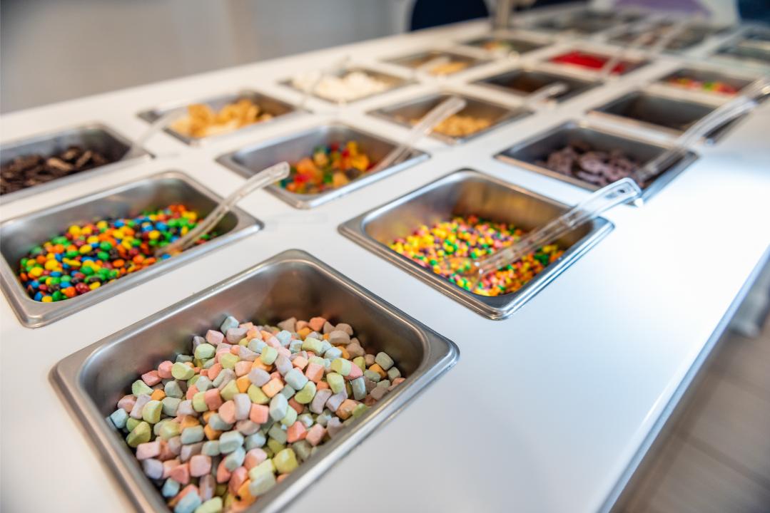 Colorful toppings bar with candy selections at Chill on the Hill