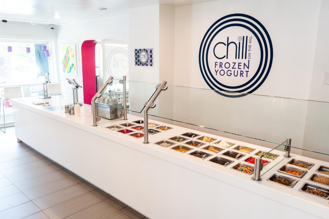 Colorful frozen yogurt topping bar inside Chill on the Hill