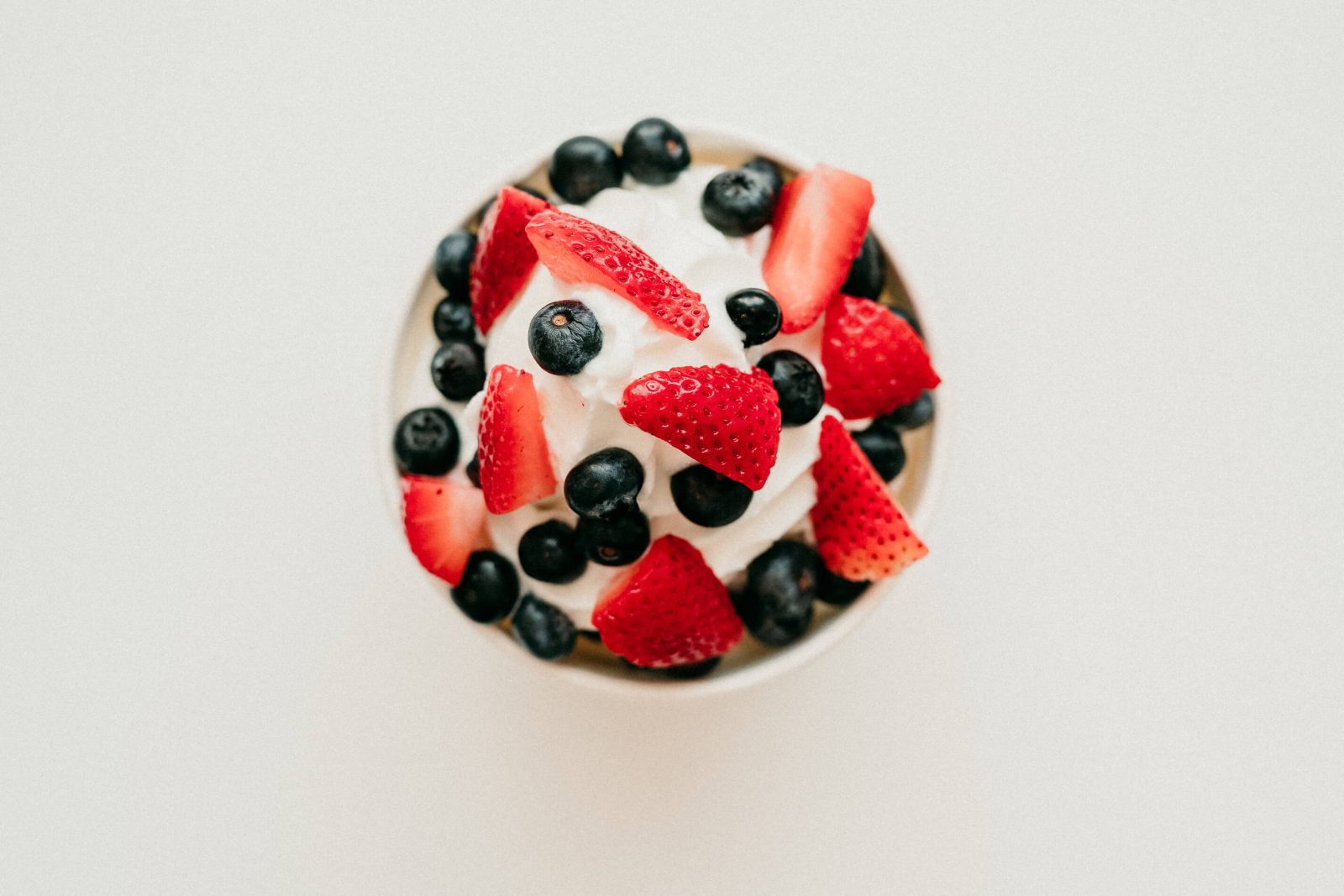 Frozen yogurt topped with fresh strawberries and blueberries at Chill on the Hill