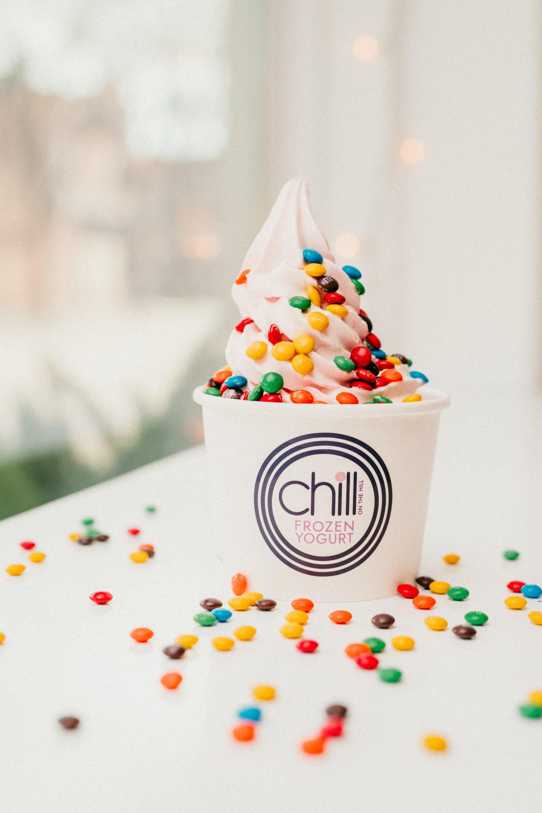 Chill on the Hill frozen yogurt cup topped with M&M's
